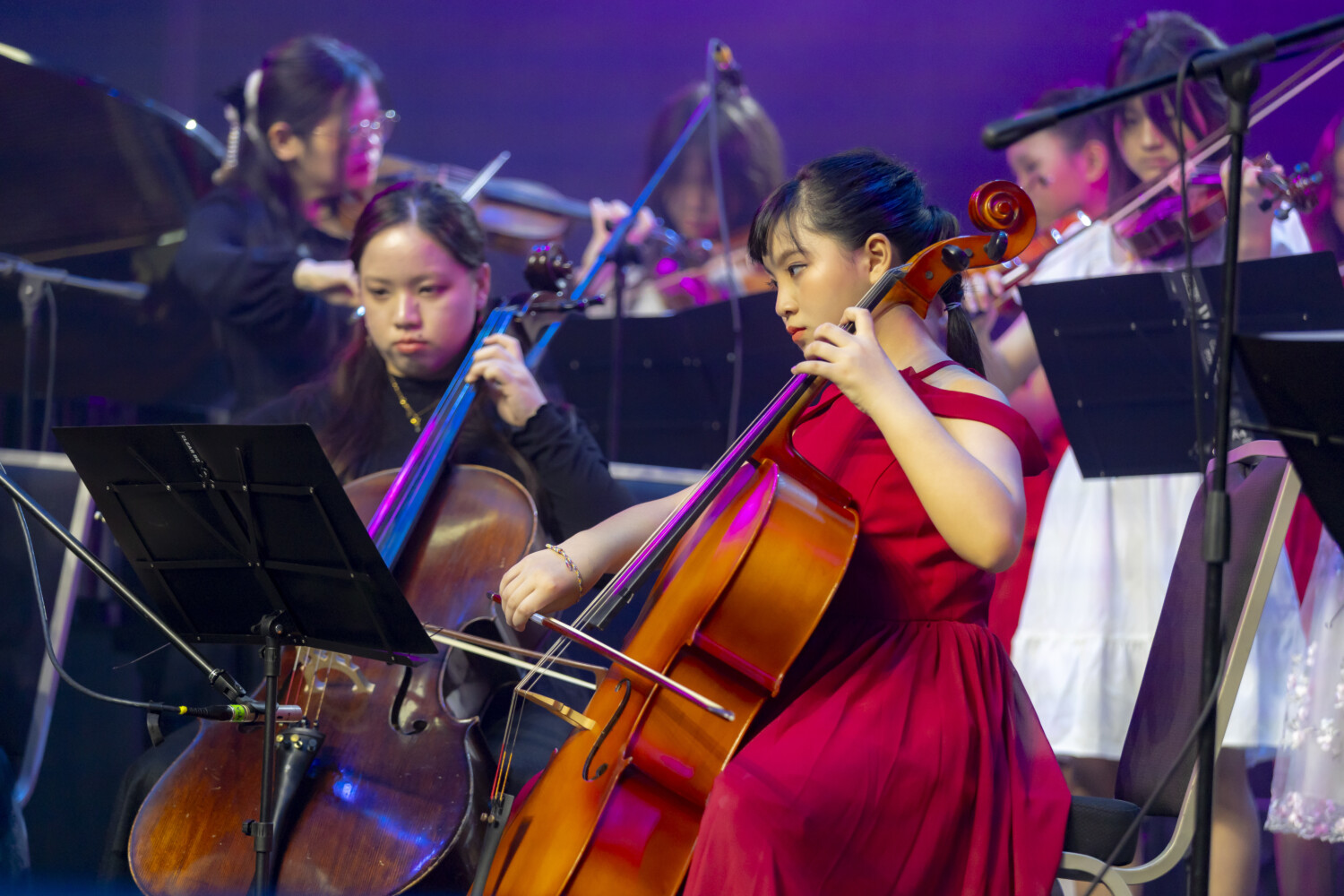 Cello student practicing correct posture and bow hold in Solaris Mont Kiara studio