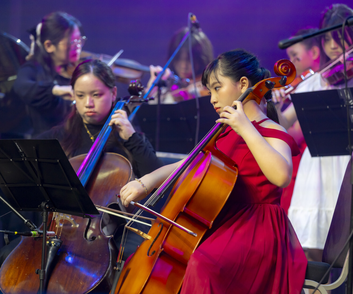 Cello student practicing correct posture and bow hold in Solaris Mont Kiara studio