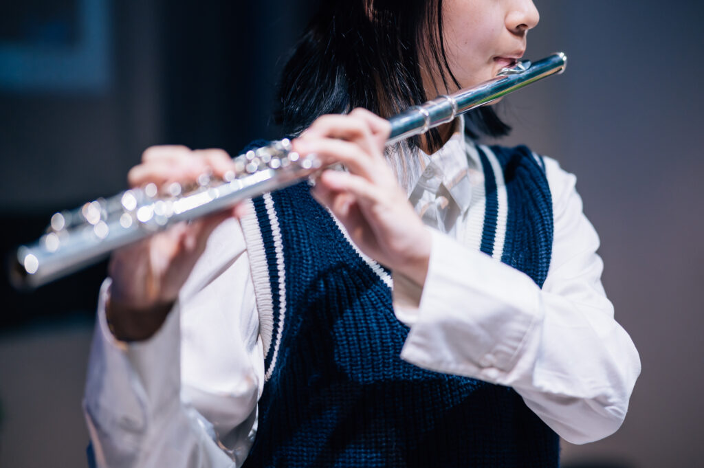 Flute student performing for music recital
